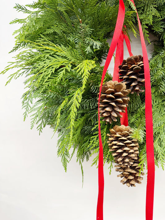 Fresh Evergreens Red Ribboned Pine Cones Wreath